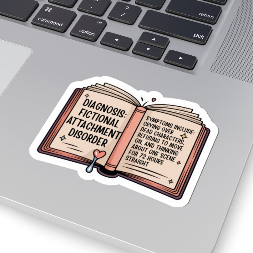 Laptop with a sticker on the palm rest area, featuring text and an open book design.