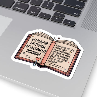 Laptop with a sticker on the palm rest area, featuring text and an open book design.